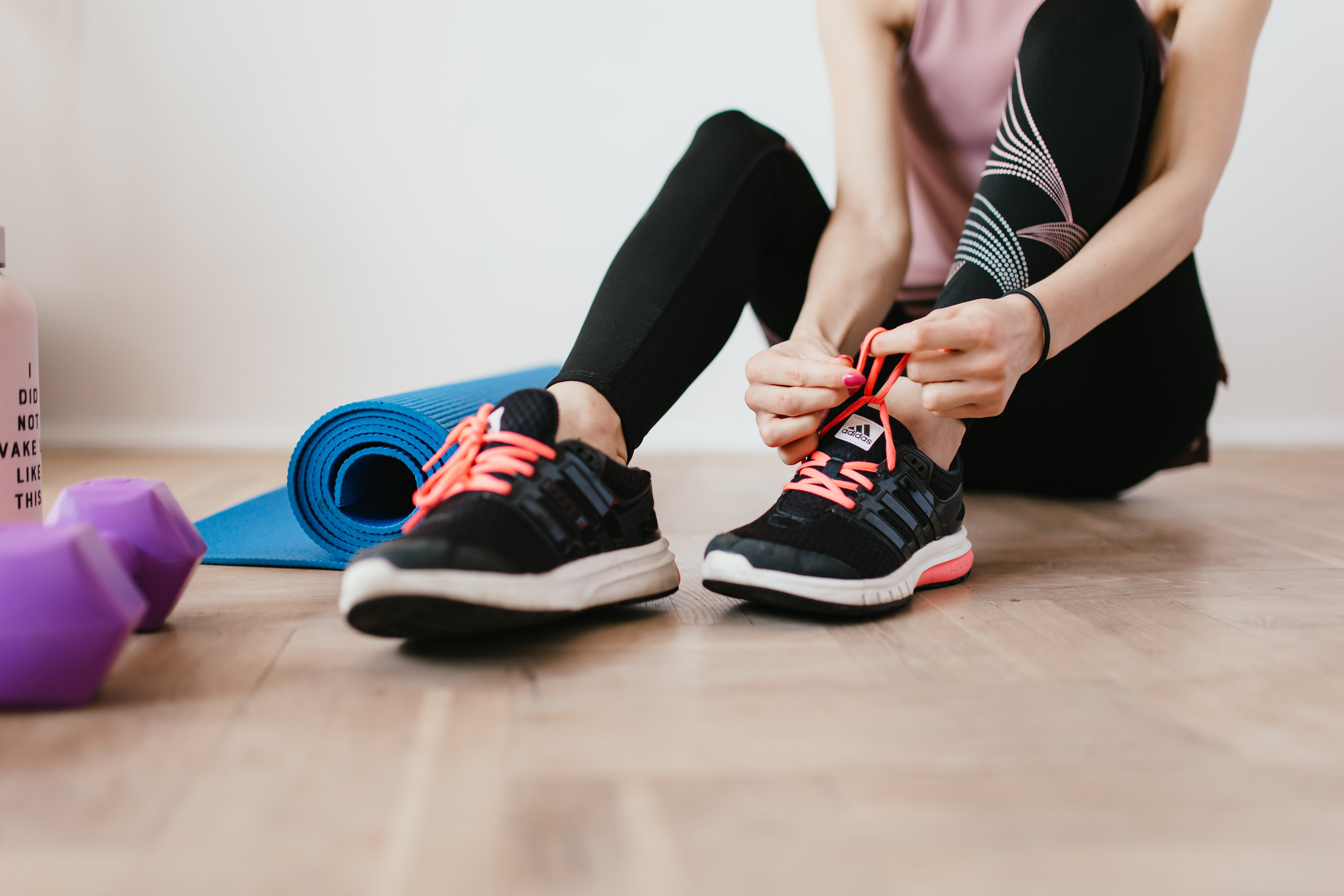 woman tying her shoelace